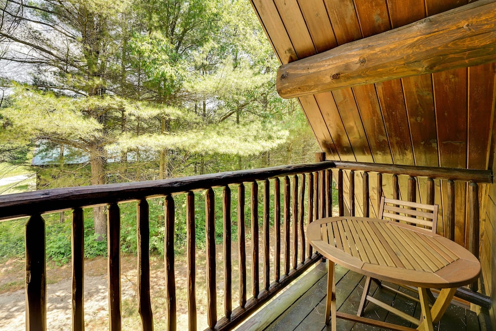 Secluded Log Cabin in NW Michigan: Hot Tub Deck - Property Image 11