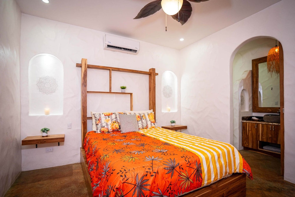 Bohemian Tropical Villa with a Tiki-Style Swimming Pool & Swim-Up Bar with an Attached Studio Apartment