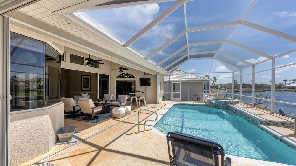 Waterfront Punta Gorda Isles 3 Bedroom pool hot tub, dock, bikes office 3 Home