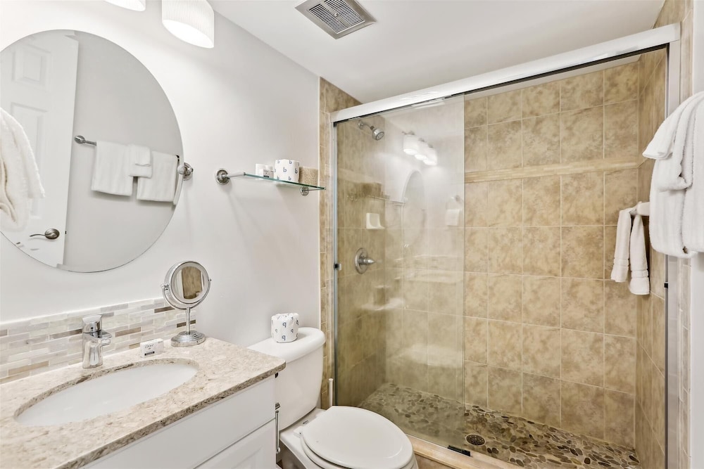 Beachfront Gem: Serene 2BD Haven With Pool & Views