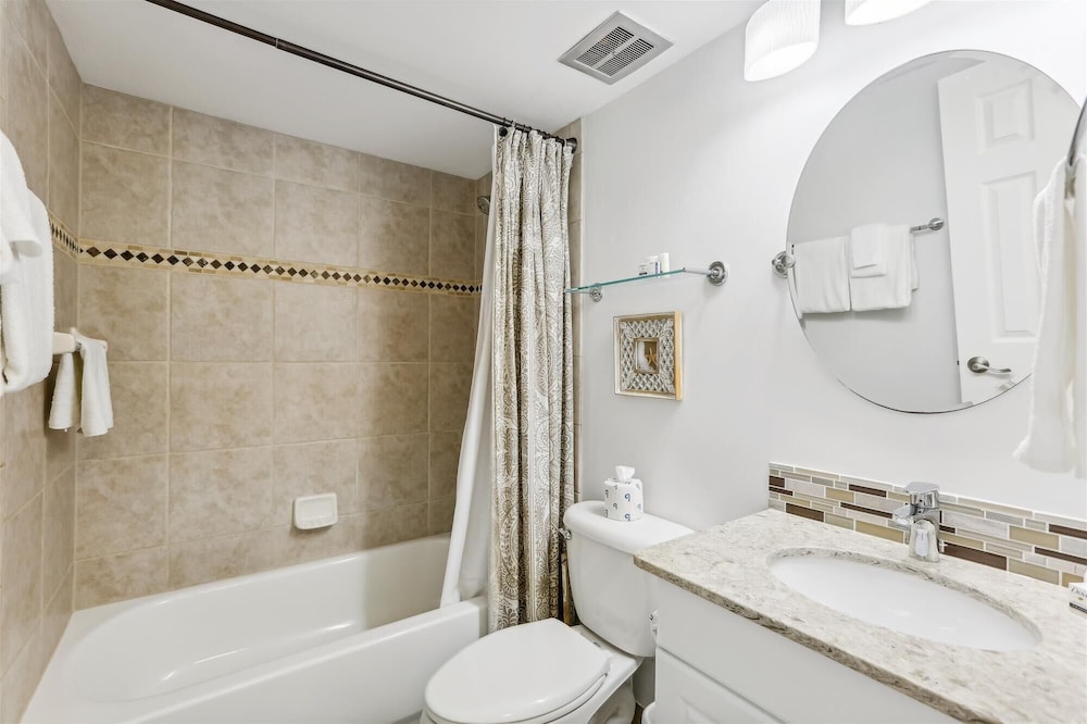 Beachfront Gem: Serene 2BD Haven With Pool & Views