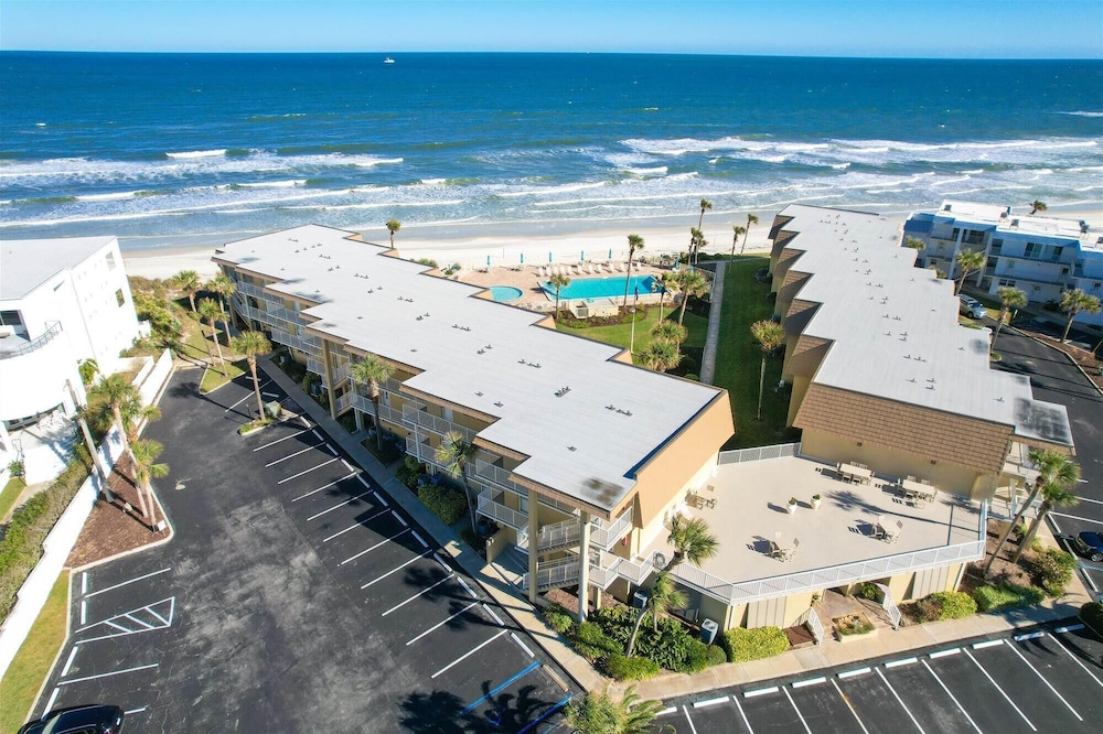 Beachfront Gem: Serene 2BD Haven With Pool & Views