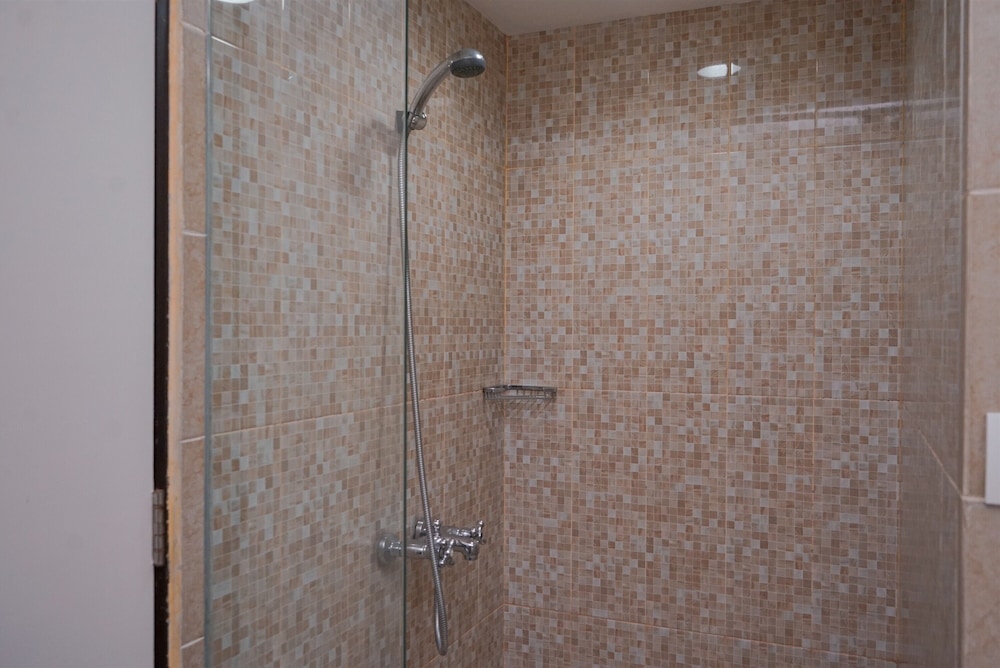 Warm and Minimalist Studio (No Kitchen) at Great Western Apartment