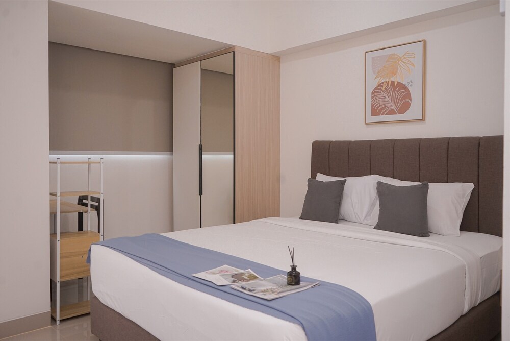 Minimalist And Warm Studio Room At Cisauk Point Apartment