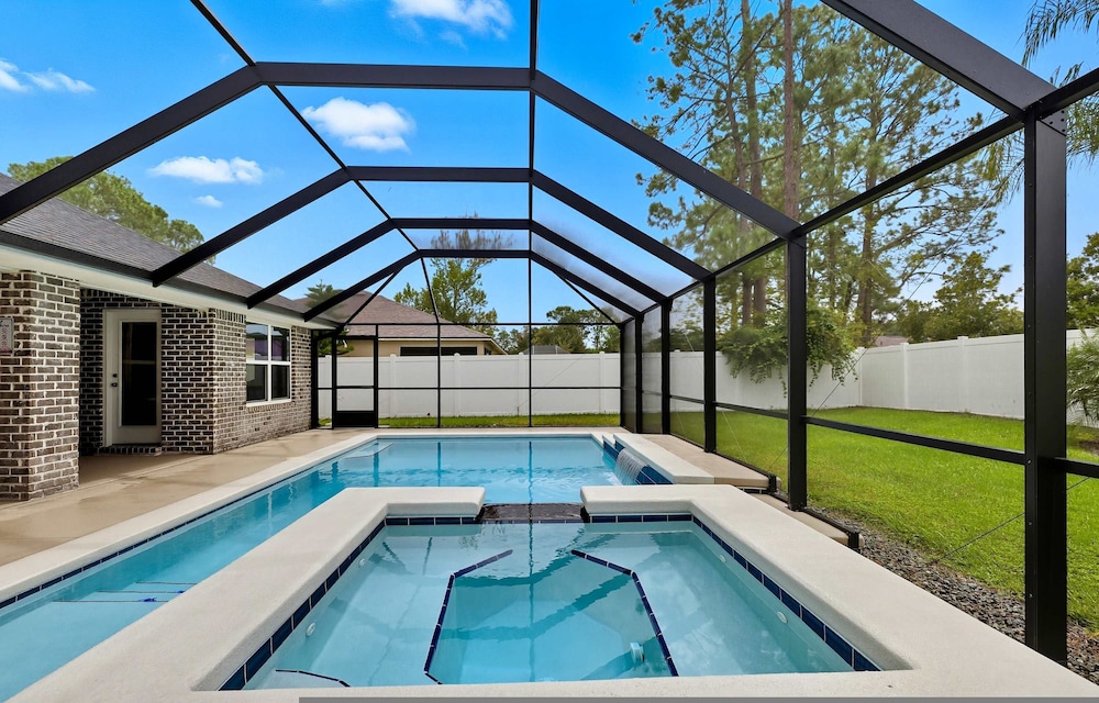 Modern 4BR Retreat Near Beach Heated Pool