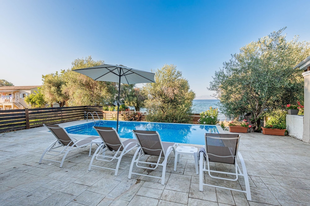 Deja Blue Beach Pool House by Estia