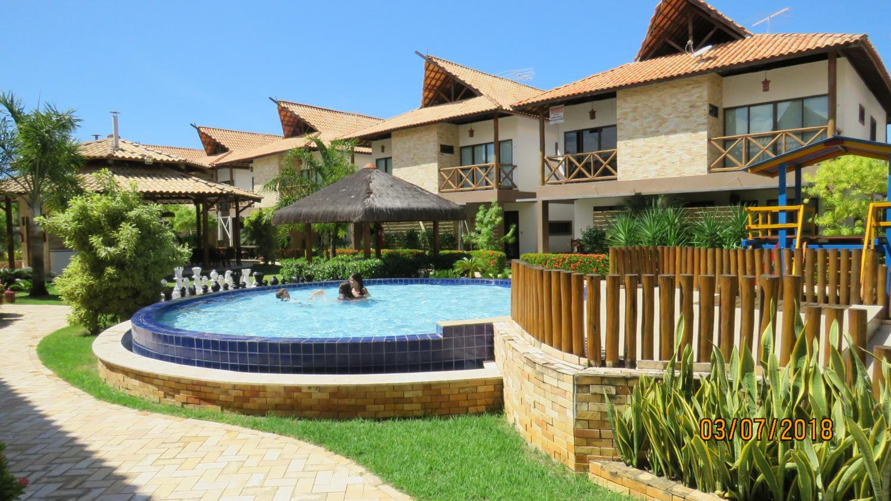 Bangalô com área de lazer estilo resort