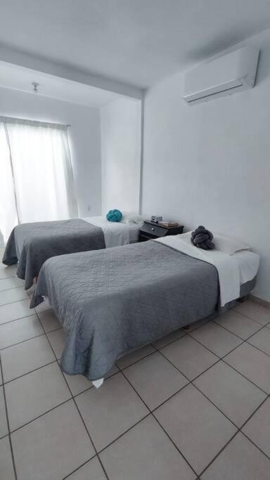 Hogar tranquilo, cerca de marina y plaza comercial