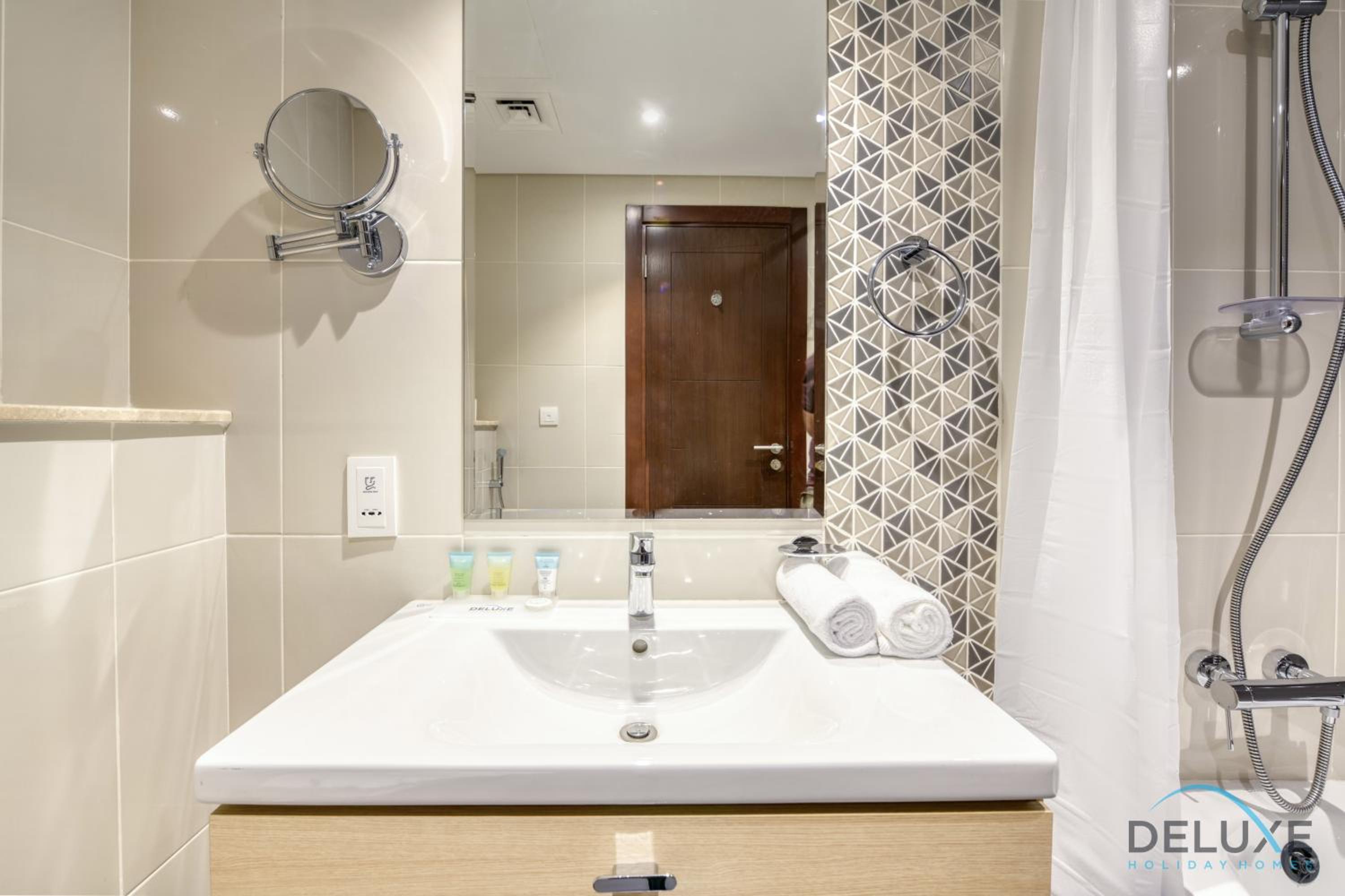 Sunlit Studio at Golf Promenade 2A DAMAC Hills By Deluxe Holiday Homes