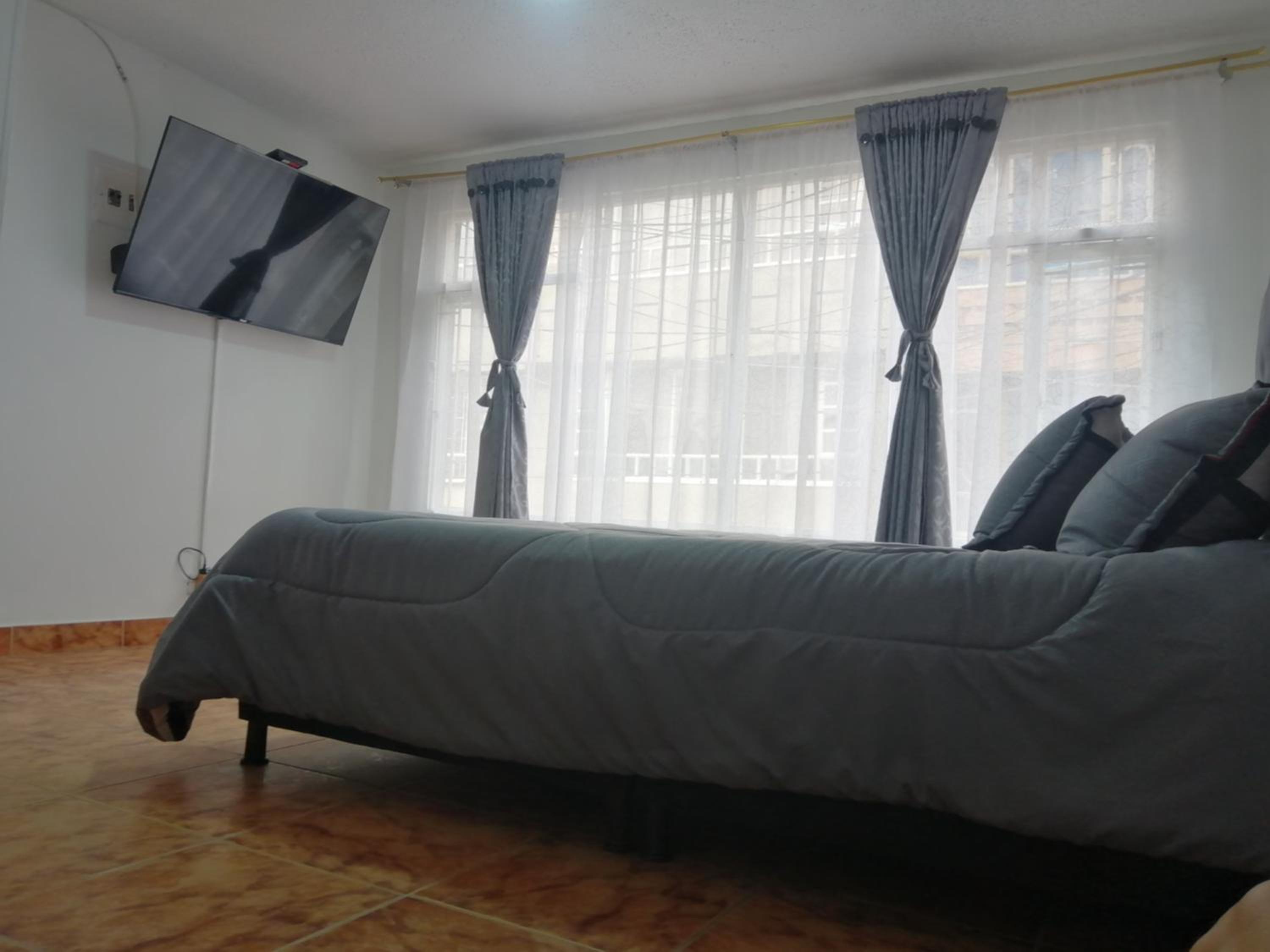 Habitación Privada Cerca al Aeropuerto y Terminal