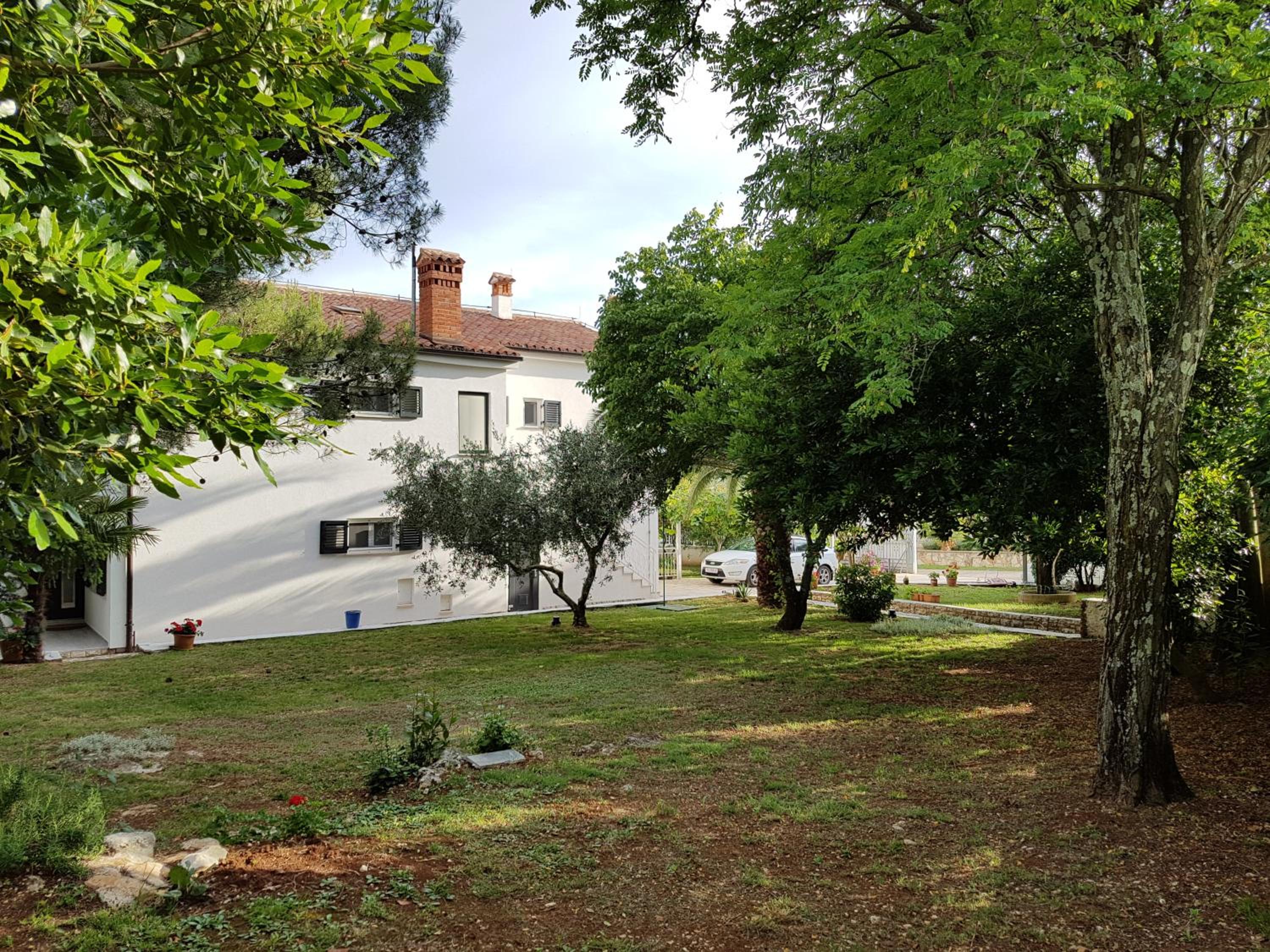 Villa Rosa with yard and children's playground view 5