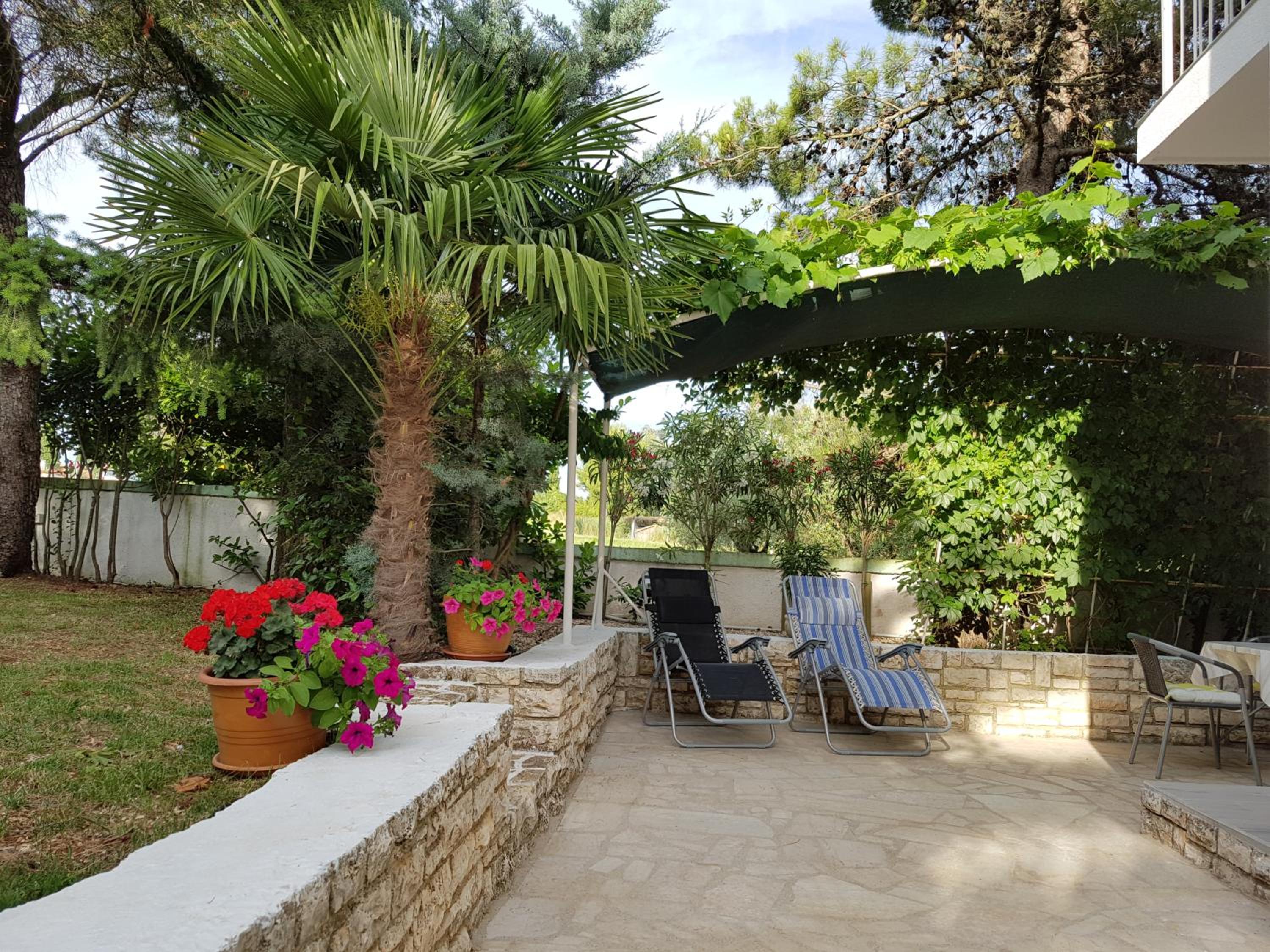 Villa Rosa with yard and children's playground