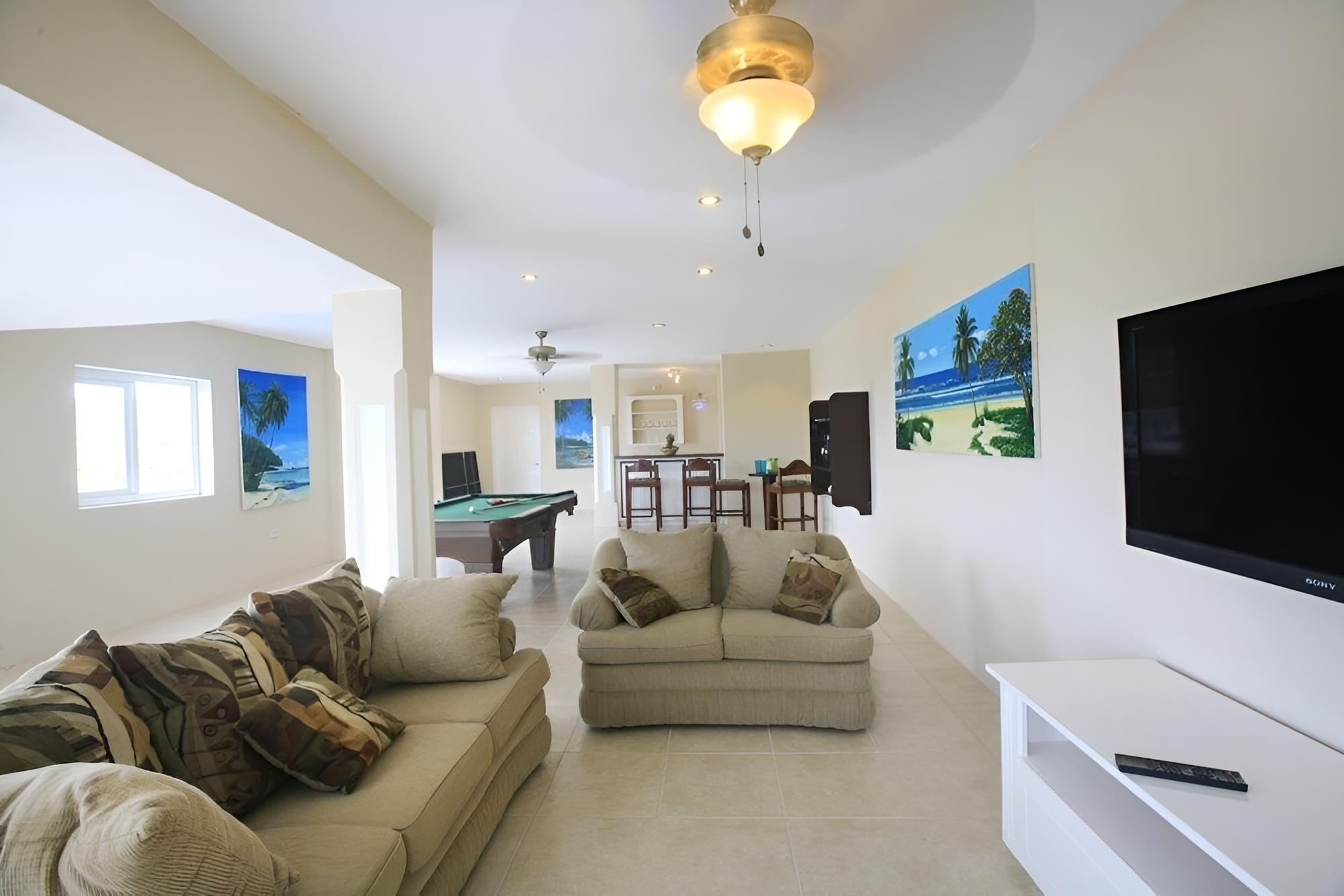 Fairway And Ocean Views - Blue Moon 4 Bedroom Villa by RedAwning