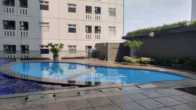 Comfy and Clean 2BR Green Pramuka City Apartment By Travelio