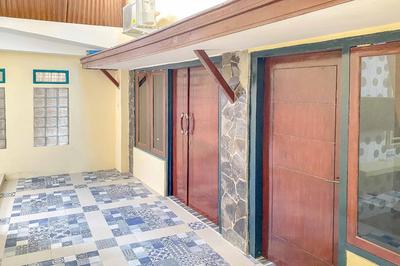 Tini's Guest House Malang Mitra RedDoorz