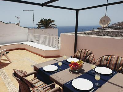 Sunset terrace with ocean views and pool access
