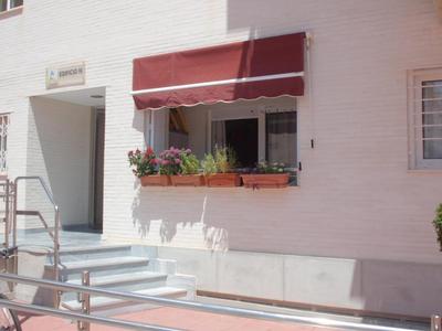 Apartamento con piscina en primera linea de playa