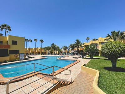 Seaside Apartment Corralejo : A cozy holiday home in a peaceful well located green complex