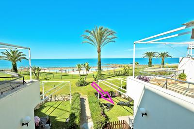 On Beach Deluxe Apartment with Pools and own Garden