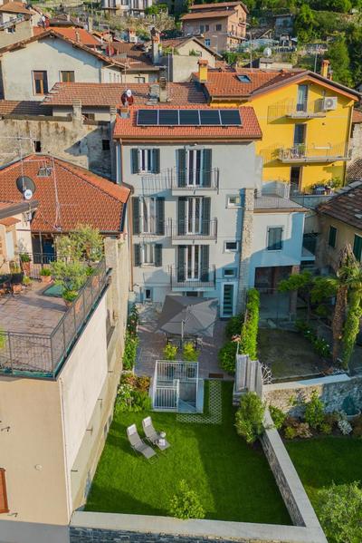 Pozzo Vertical Apartment with garden and parking by Rent All Como