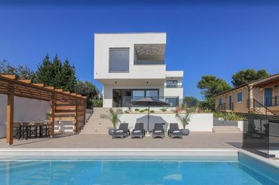 New modern luxury villa near the beach with sea view, pool, sauna , BBQ and playground by WiiBuk