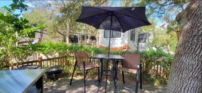 Spacious Four room glamping Rv with Tiki bar including golf cart