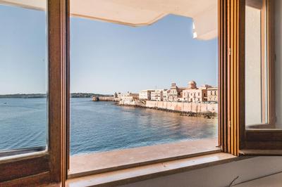 Una Finestra Su Cala Rossa by Wonderful Italy
