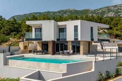 Beachfront Luxury Villa Mare, featuring a heated pool, fitness area, and sauna