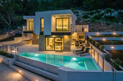 Beachfront Luxury Villa Luce, featuring a heated pool, fitness area, and sauna