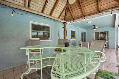 Salt Water Heated Pool Home with a Tiki Bar, a Garage Game Room and 4 Bikes