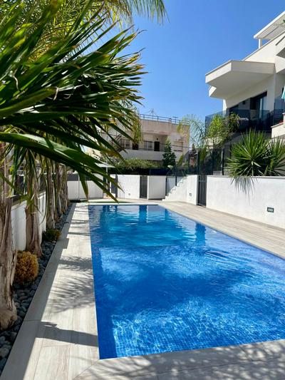 Air-conditioned Elisa Apartment with spacious sunroof lounge and swimming pool