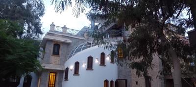 Khufu house pyramids view