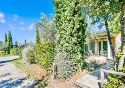 Green building-residence with swimming-pool immersed in the Tuscan countryside, elegant cottages with air conditioning and private outdoor space
