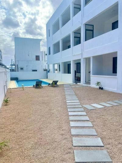 Skyview Apartment- Poolside Stay Near the Beach