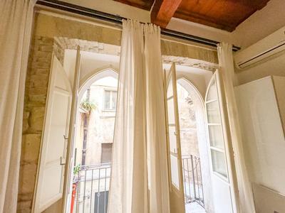 Kalma Via Manno - Central Stay with Stone Walls & Private Cinema