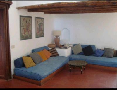 Antica casa eoliana con terrazza vista sul faro di Strombolicchio e giardino