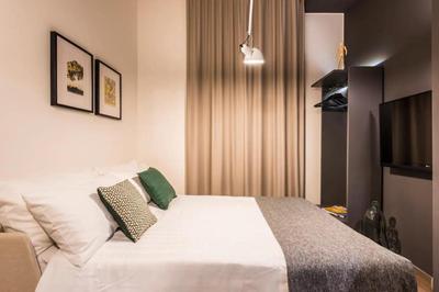 Eco Chic room with sofa bed and kitchen by Design Club Collection