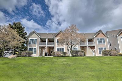 Bright Manistee Condo w/ Beach + Pool Access!