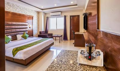 Treebo Grand Legacy Elite With Roof Top Cafe