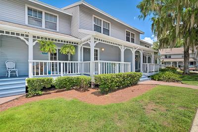 Old Florida Setting w/ Kayaks & Fishing Poles