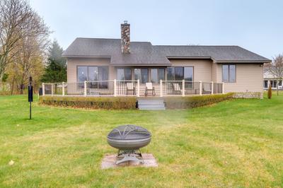 Cadillac Vacation Rental w/ Dock on Lake Mitchell!