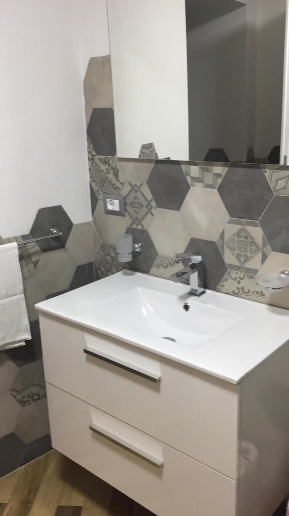 Three-Bedroom House - Photo 17