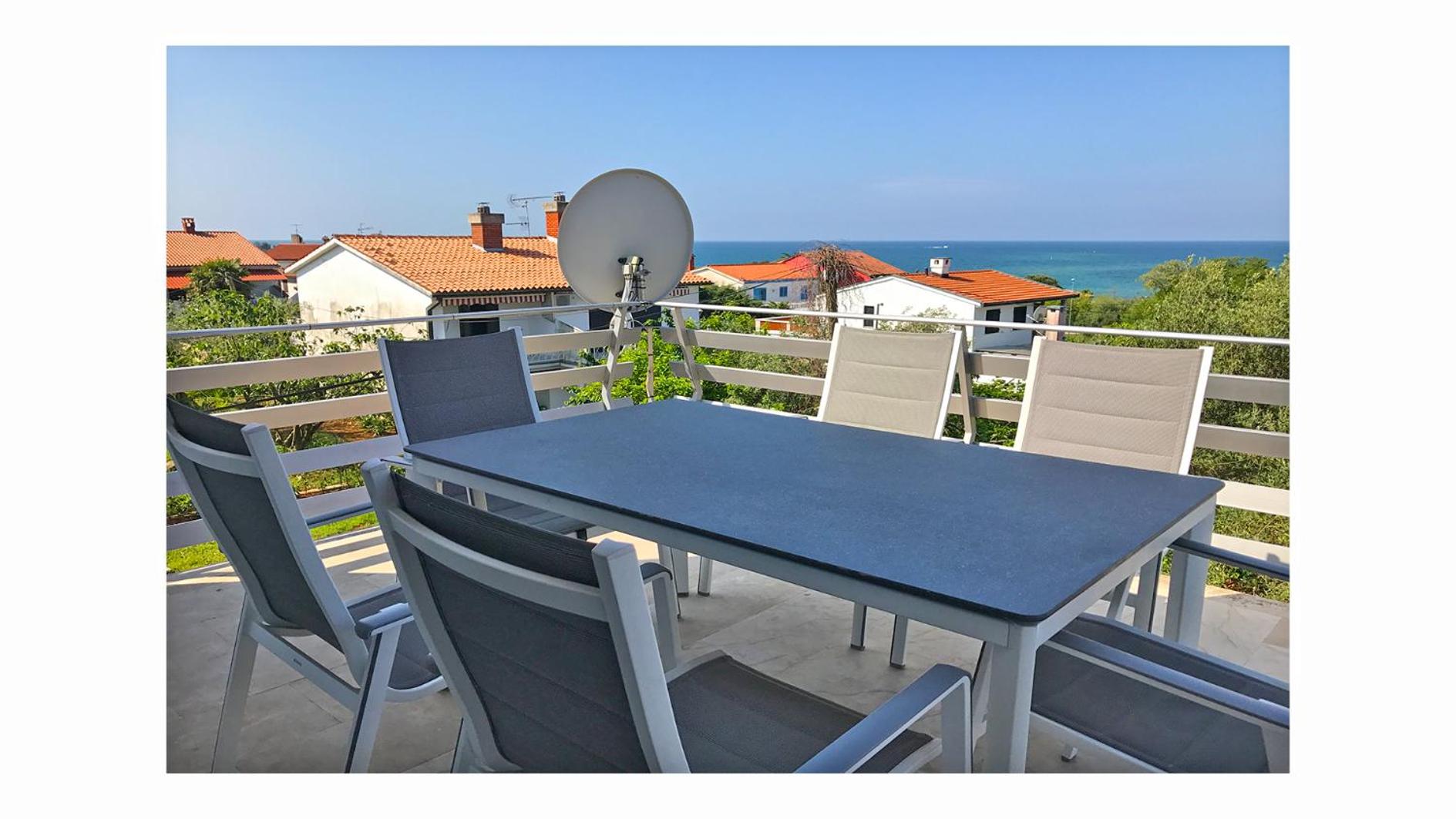 Three-Bedroom Apartment with Terrace and Sea View