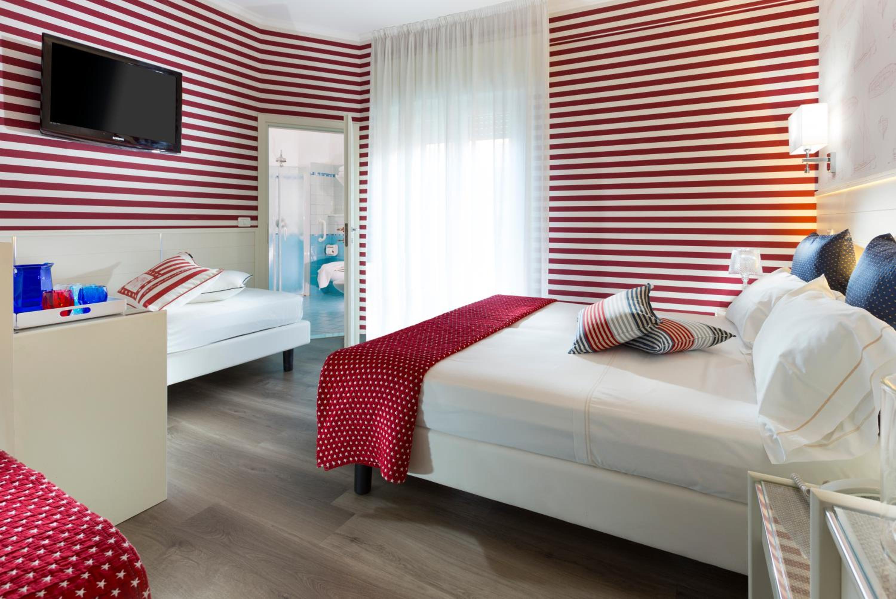 Deluxe Quadruple Room with Balcony