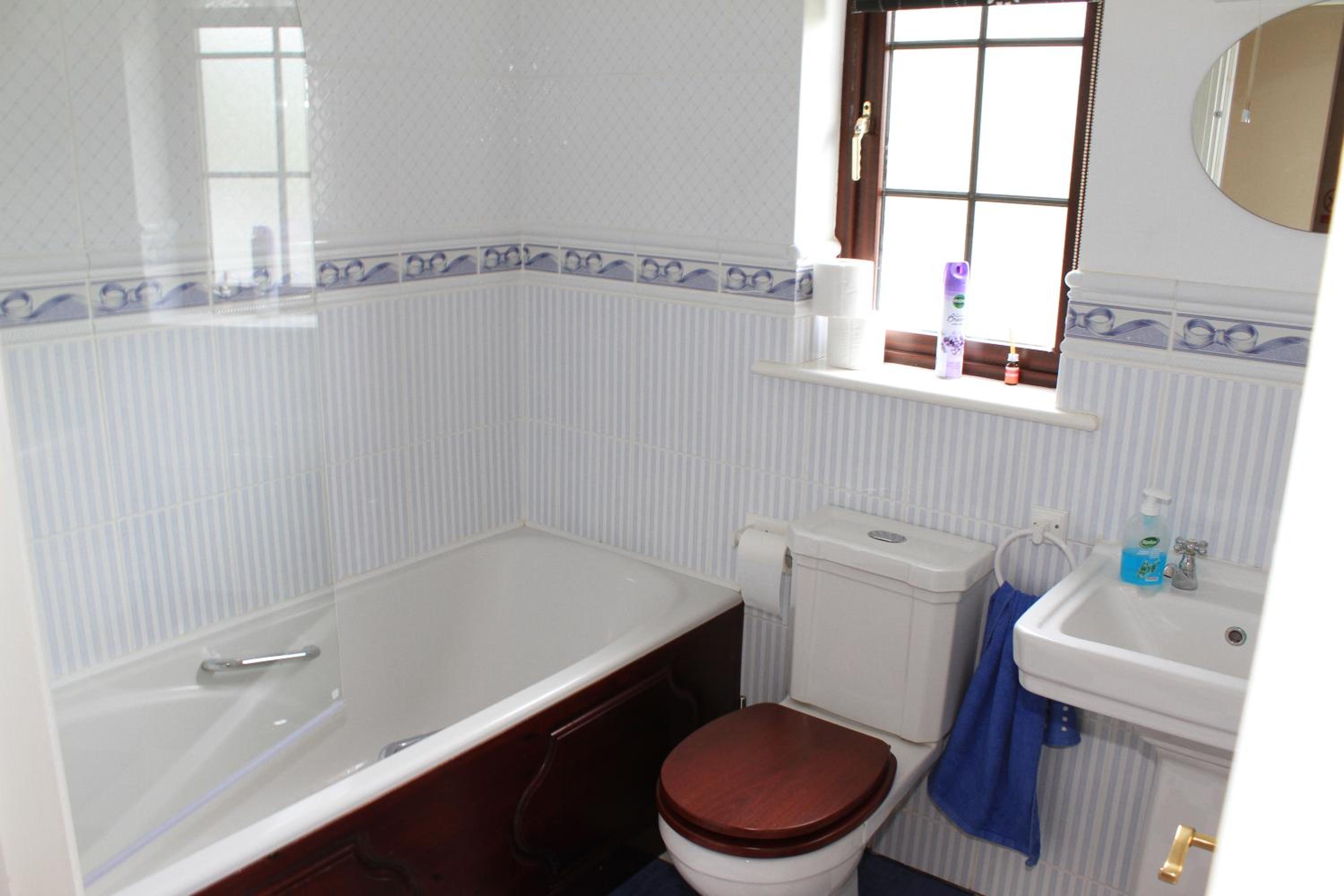 Three-Bedroom House - Photo 18