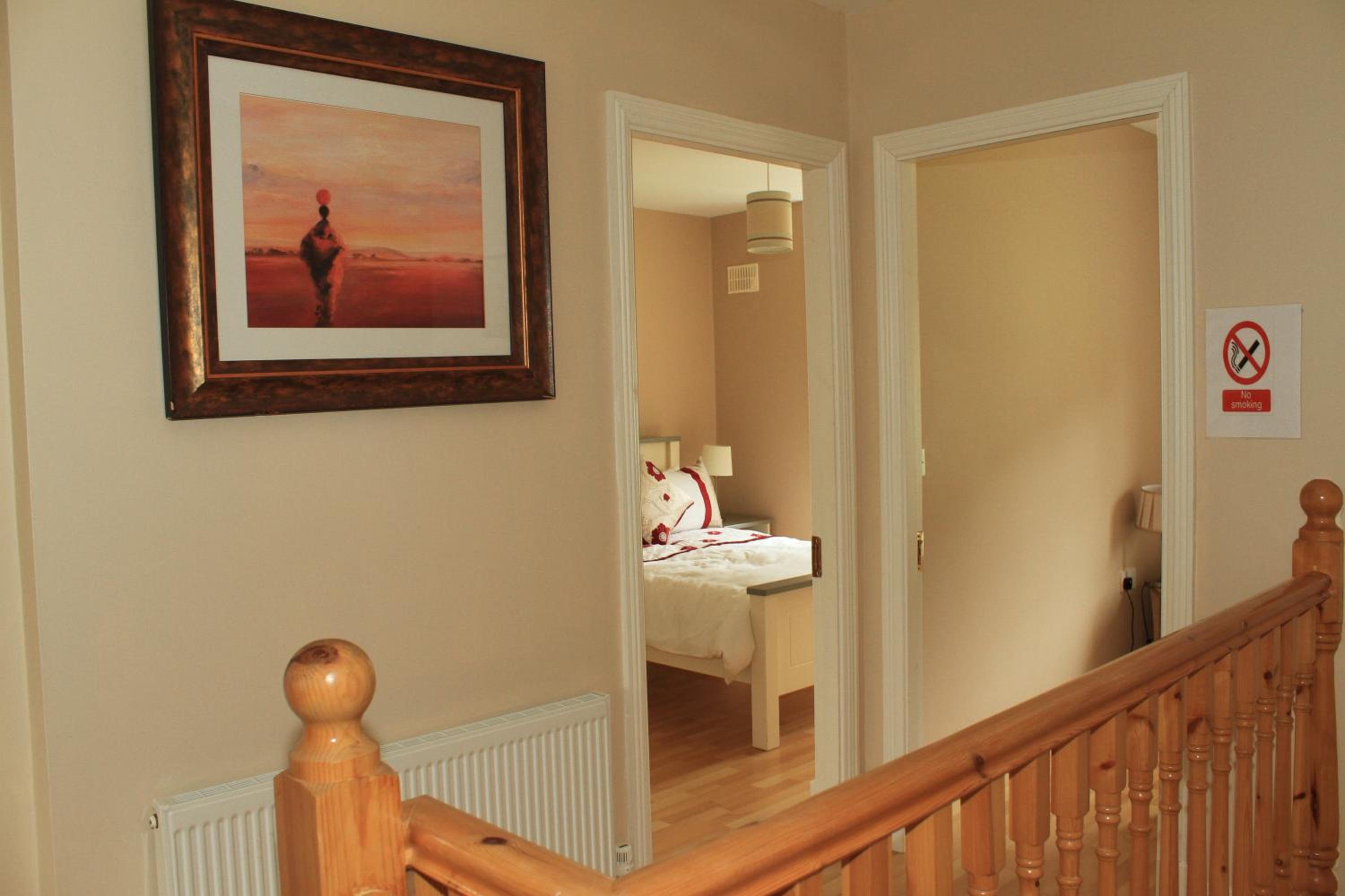 Three-Bedroom House - Photo 31