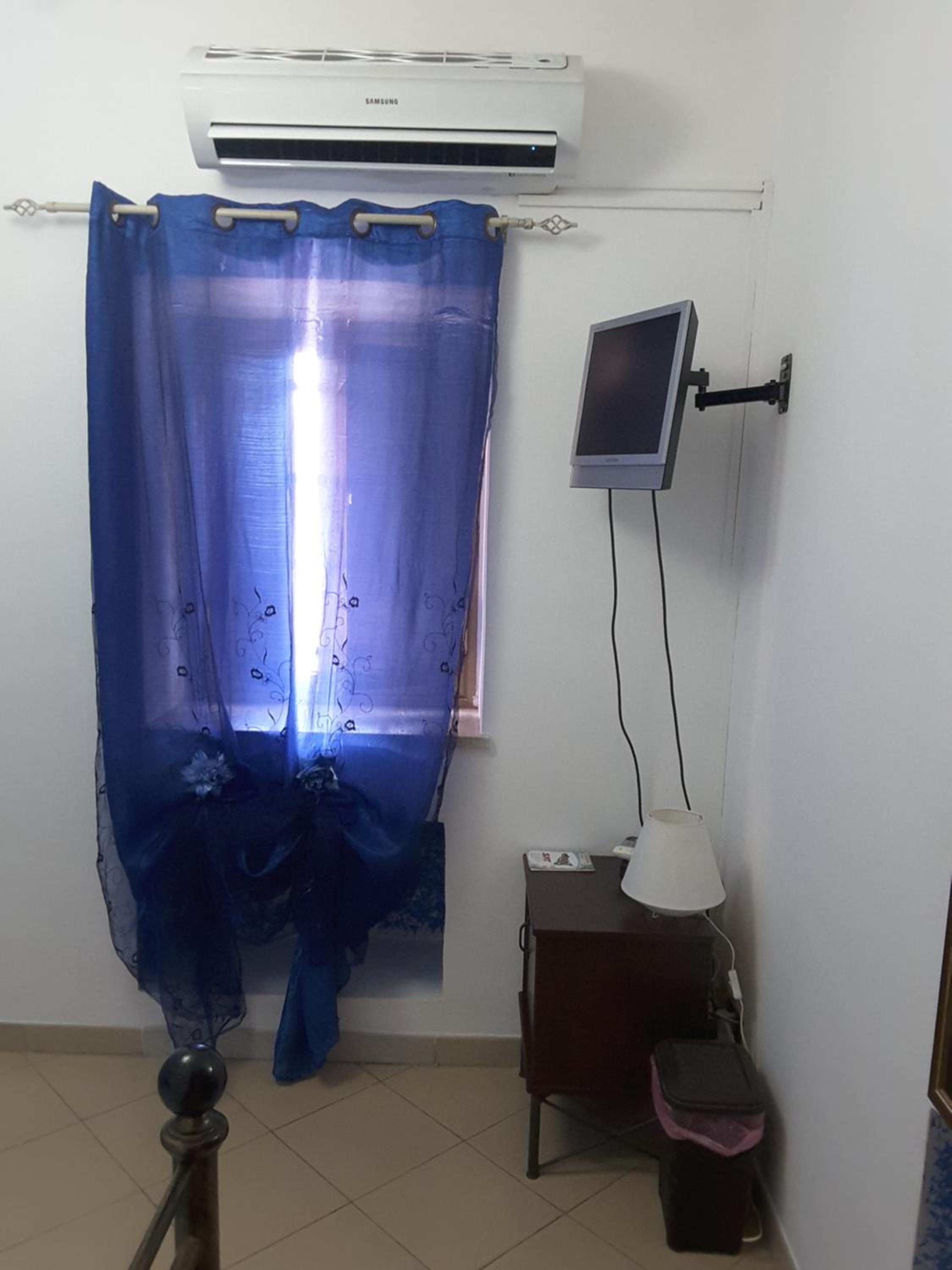 Camera Singola con bagno condiviso
