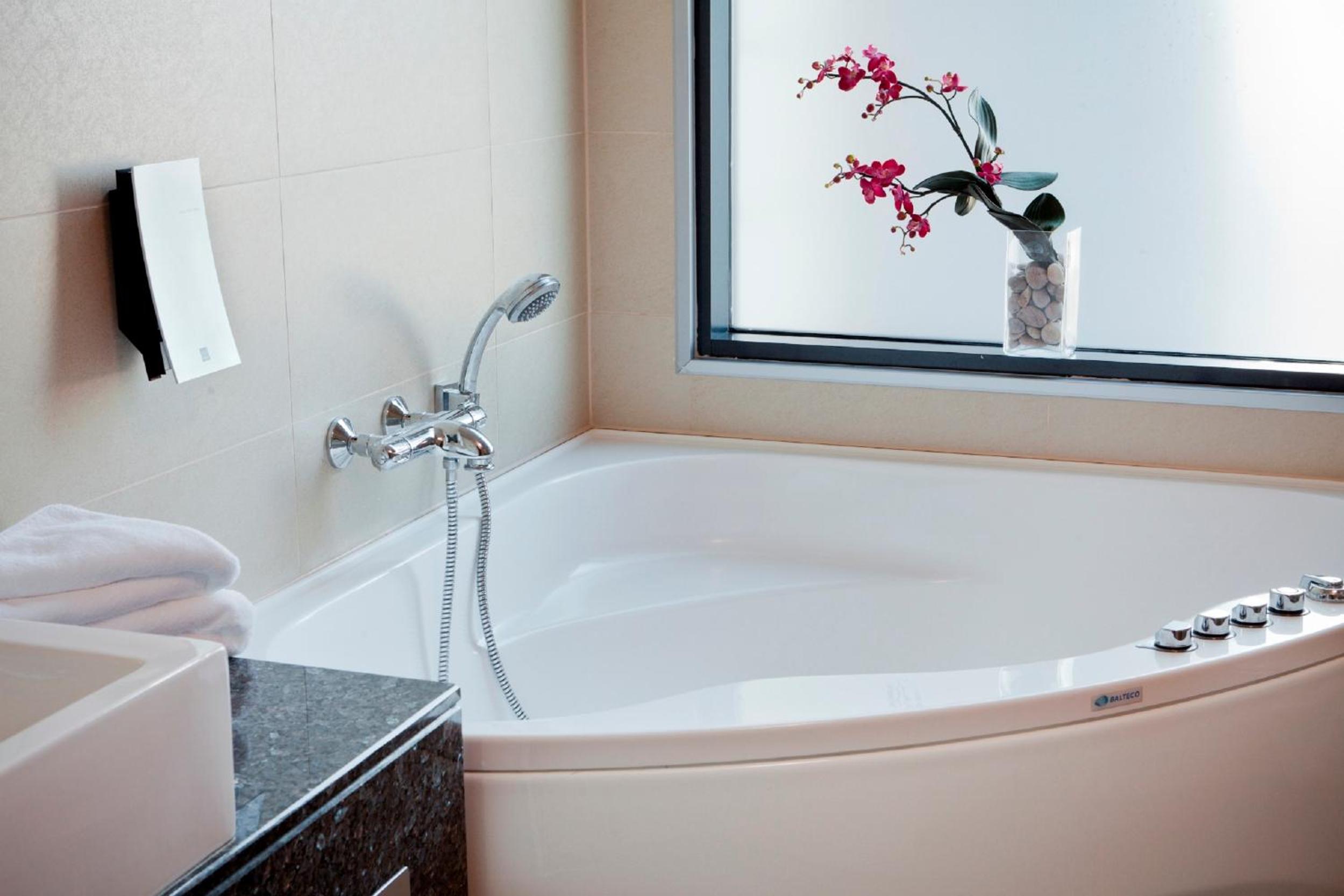 Indulge in luxury and relaxation in our elegant spa-like bath.