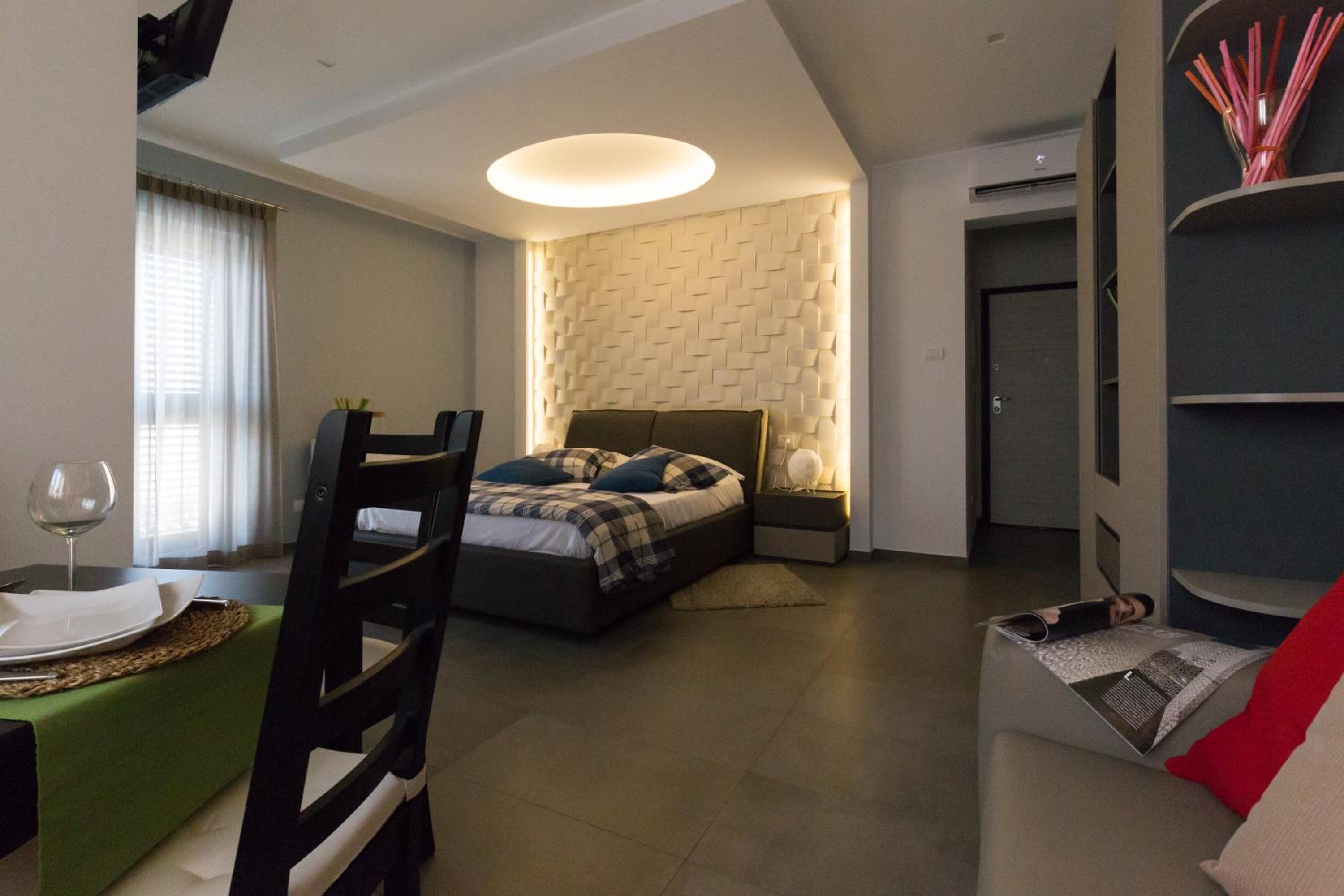 Deluxe Quadruple Room - Photo 10