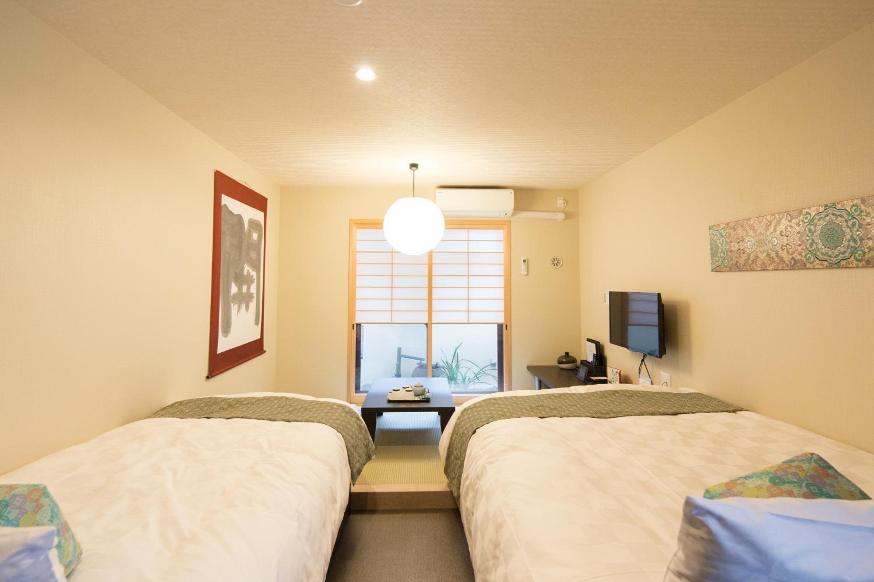 Twin Room with Tatami Area and Garden View thumbnail 6